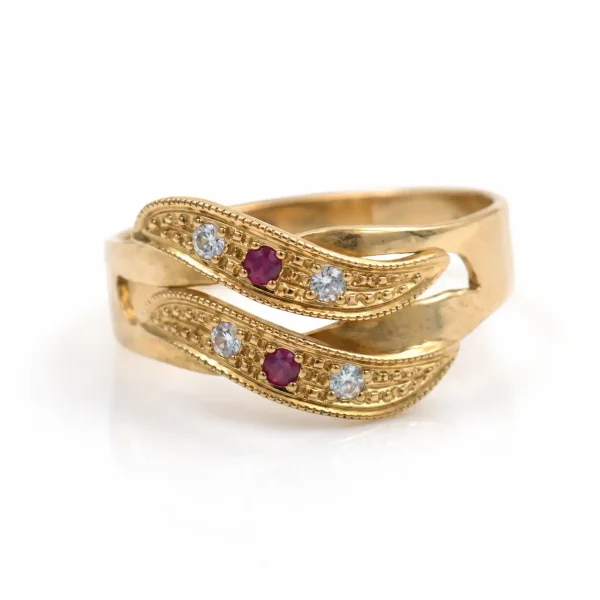Anillo de oro para mujer 18k diseño entrelazado con 2 circones morados y 4 circones transparentes
