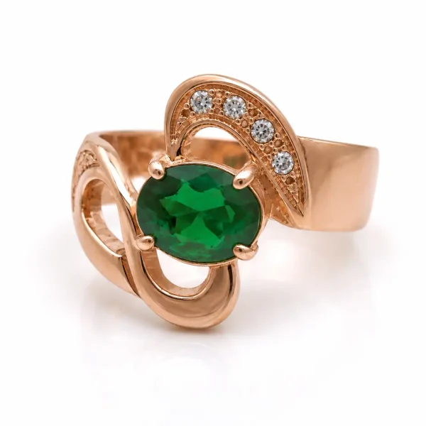 Anillo de oro para mujer 18k diseño calado ondulado con 1 circón verde central y 5 circones transparentes
